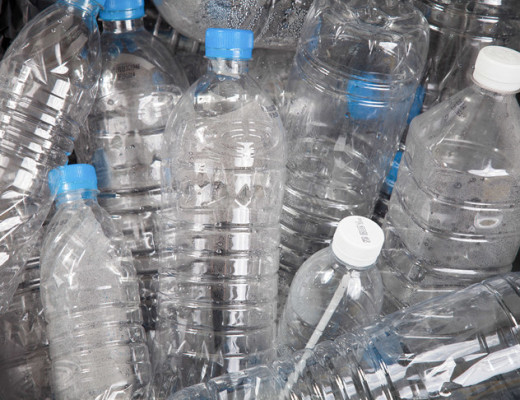 Gather a vast range of different empty plastic water bottles