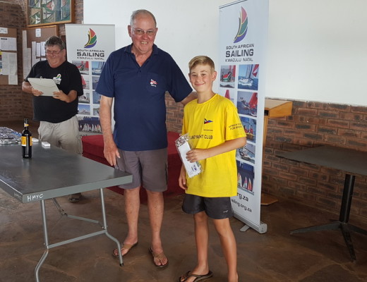 Ethan Hooper received his award for second place in the Oppie class from Henley Midmar Yacht Club Commodore, Dereck Wilkes
