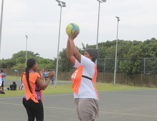 Slindi Zulu of Jozini trying to score at netball while Thabile Ndlela of Newcastle defends